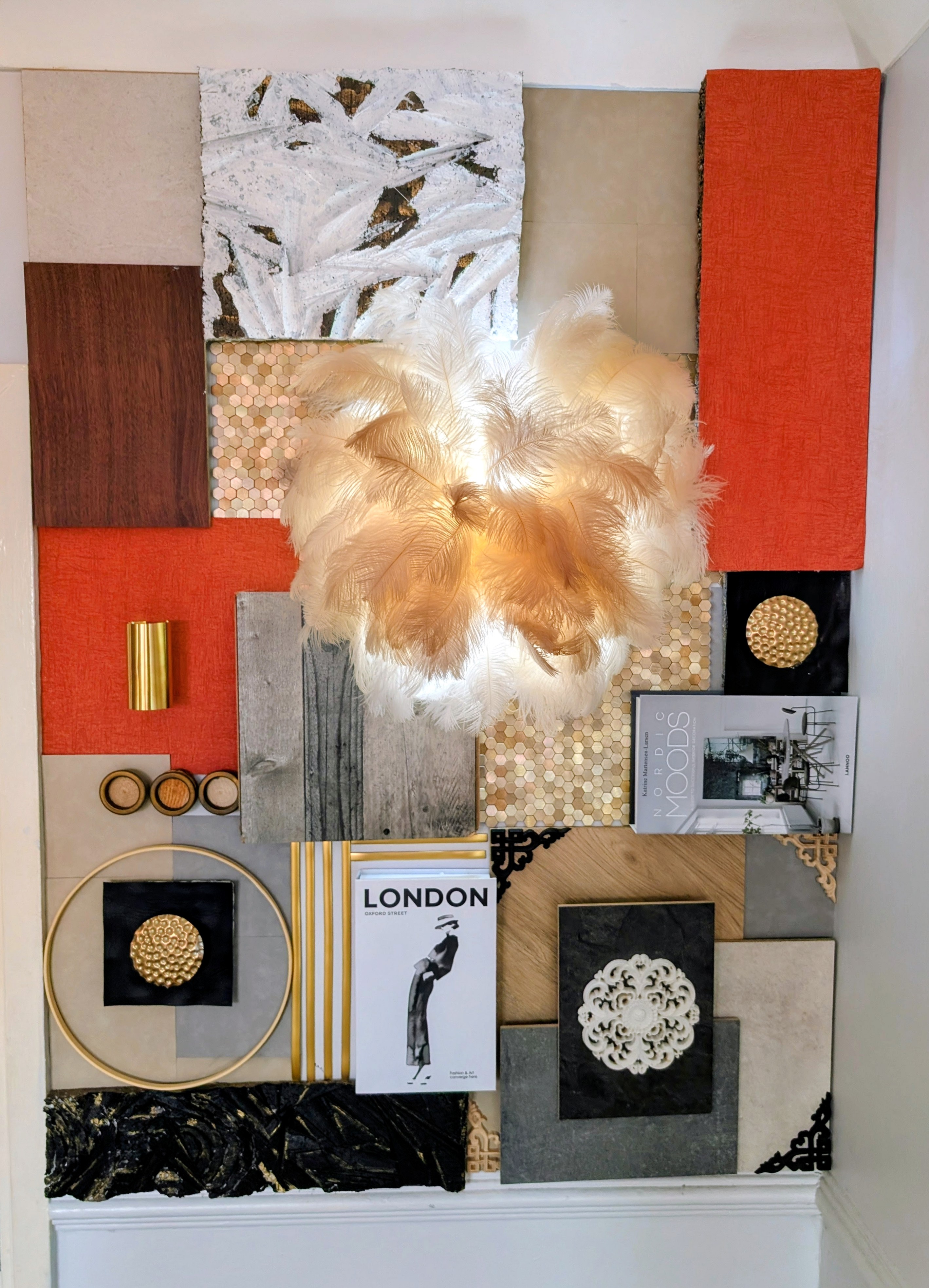 Feather lamp and materials mood wall installation