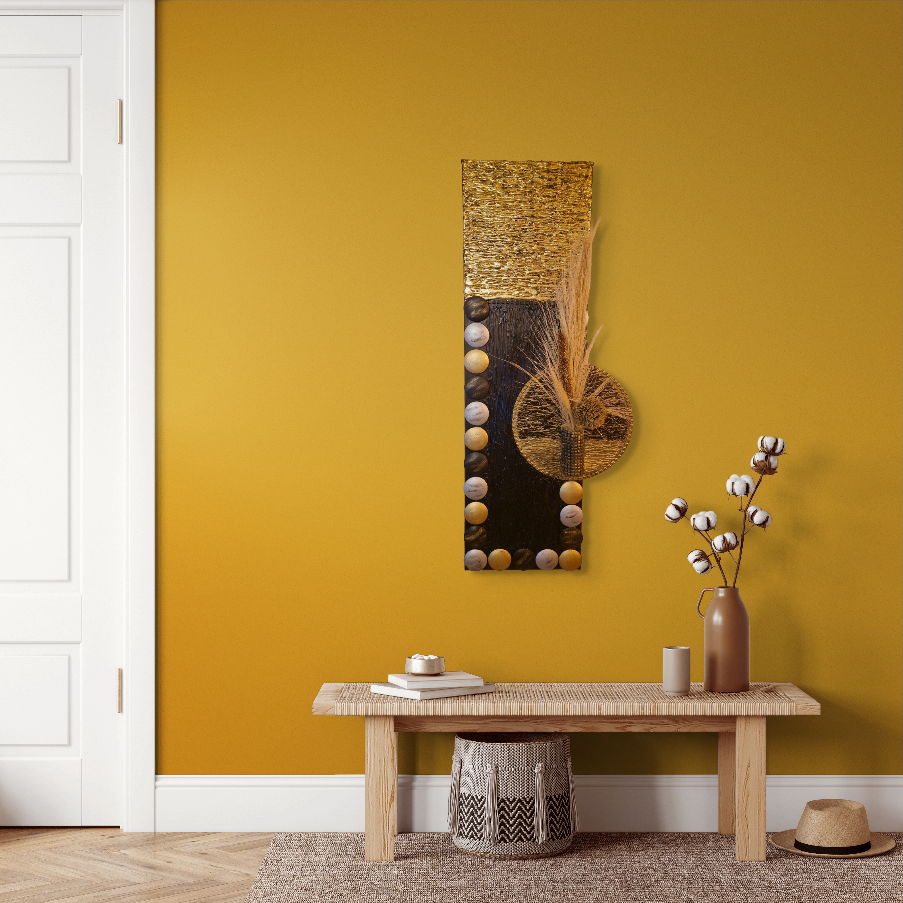 Gold sculptural canvas on mustard wall