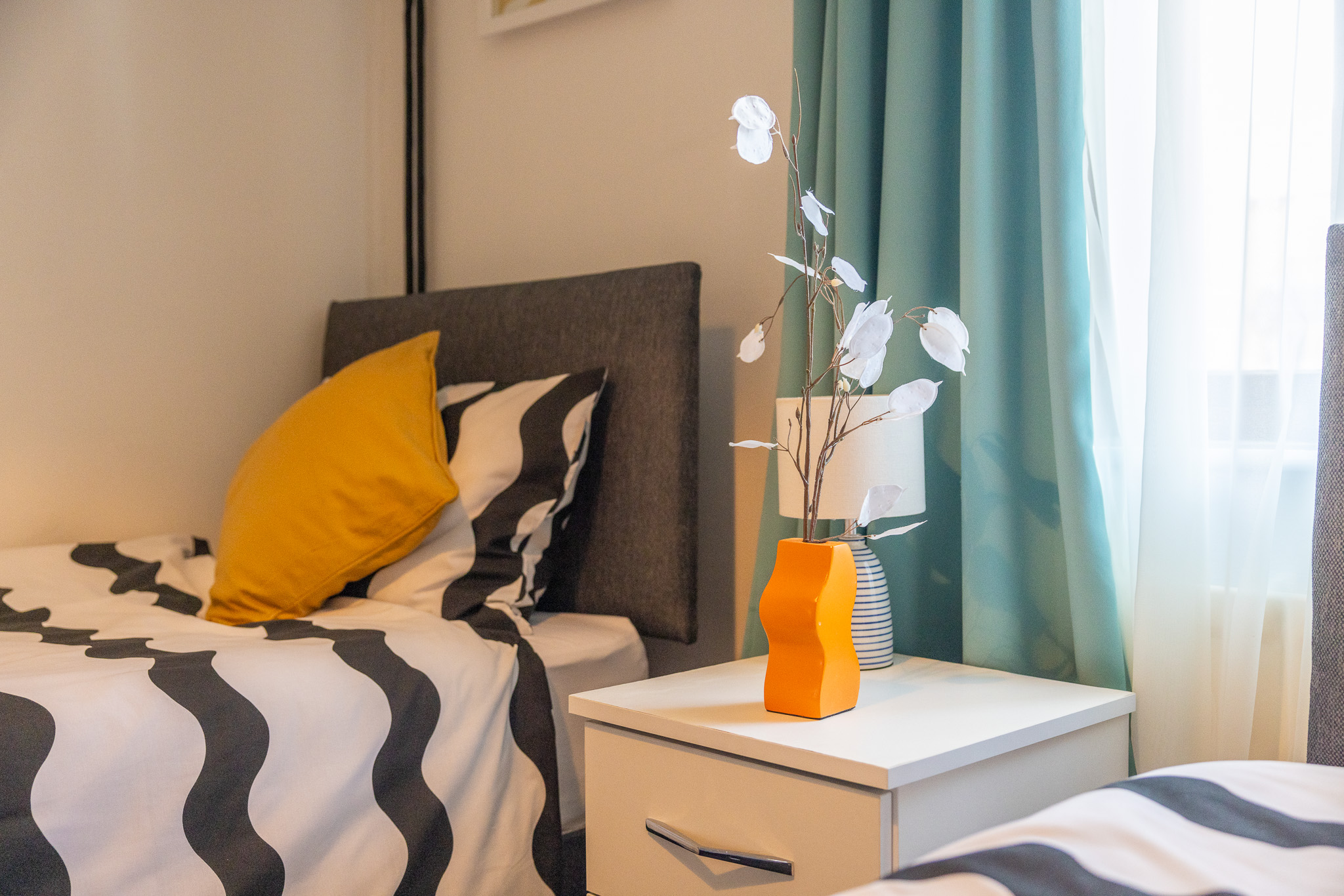 Dining area with yellow place settings and Moroccan runner