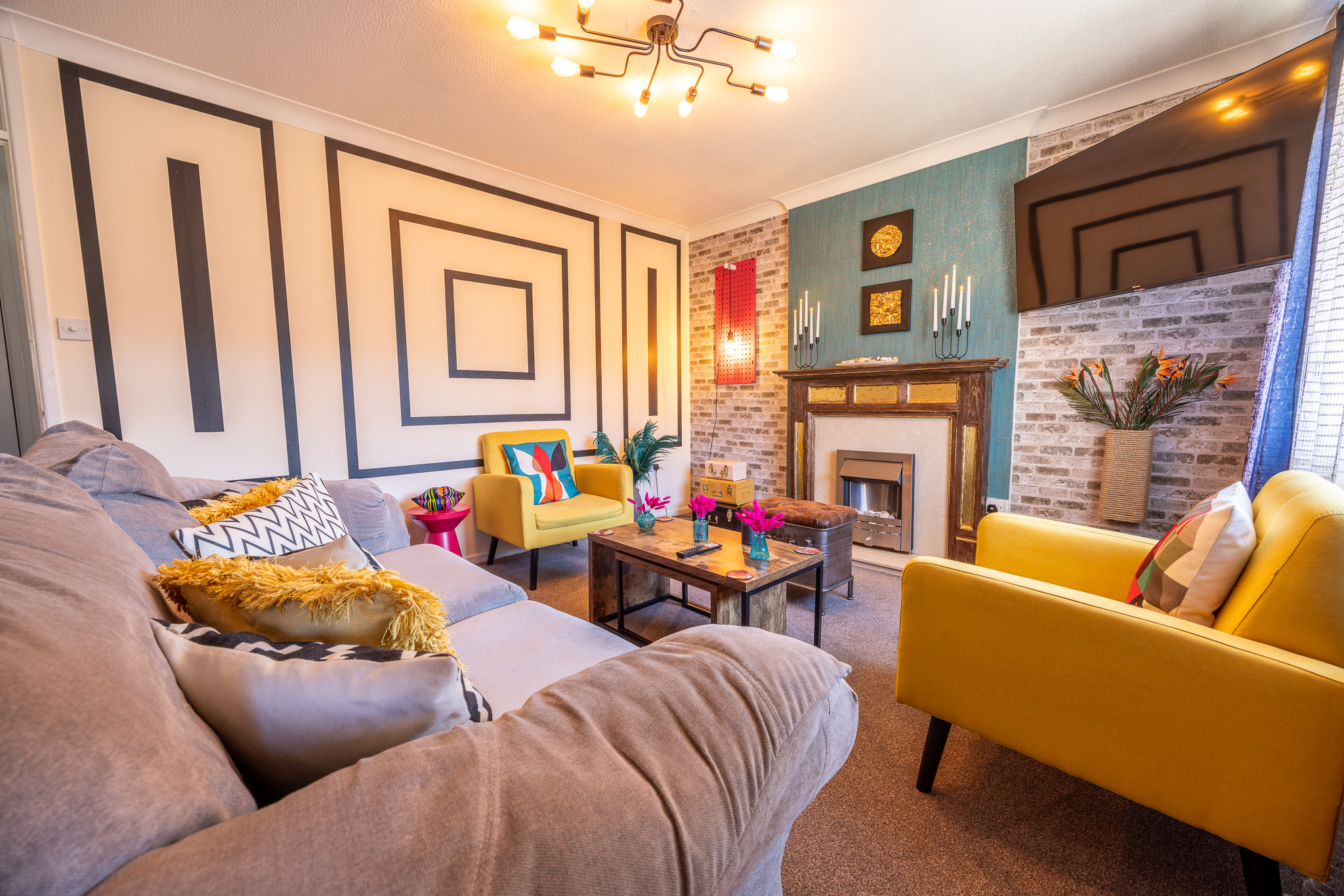 Dean's Way — bold eclectic living room with teal wall and yellow armchairs