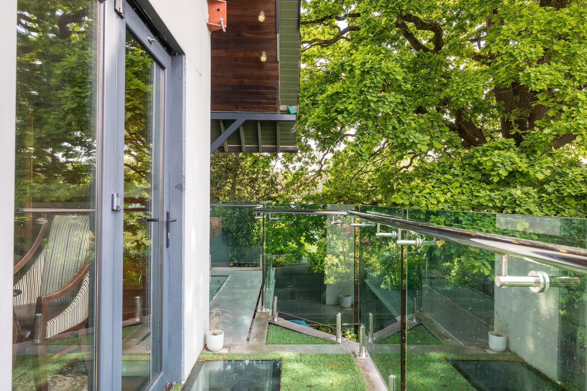 Deco Noir glass balcony 250 year oak