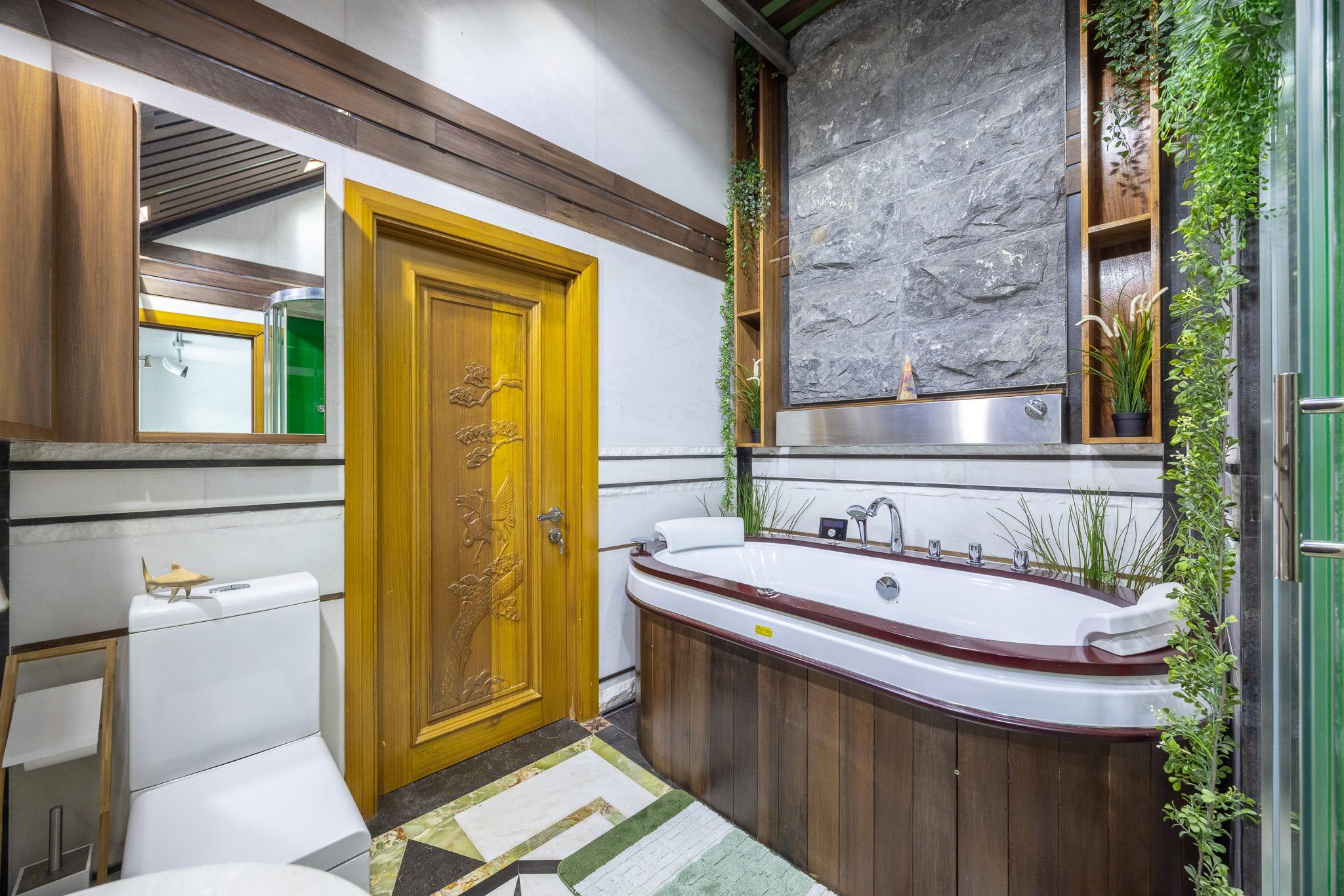 Deco Noir jacuzzi waterfall spa bathroom