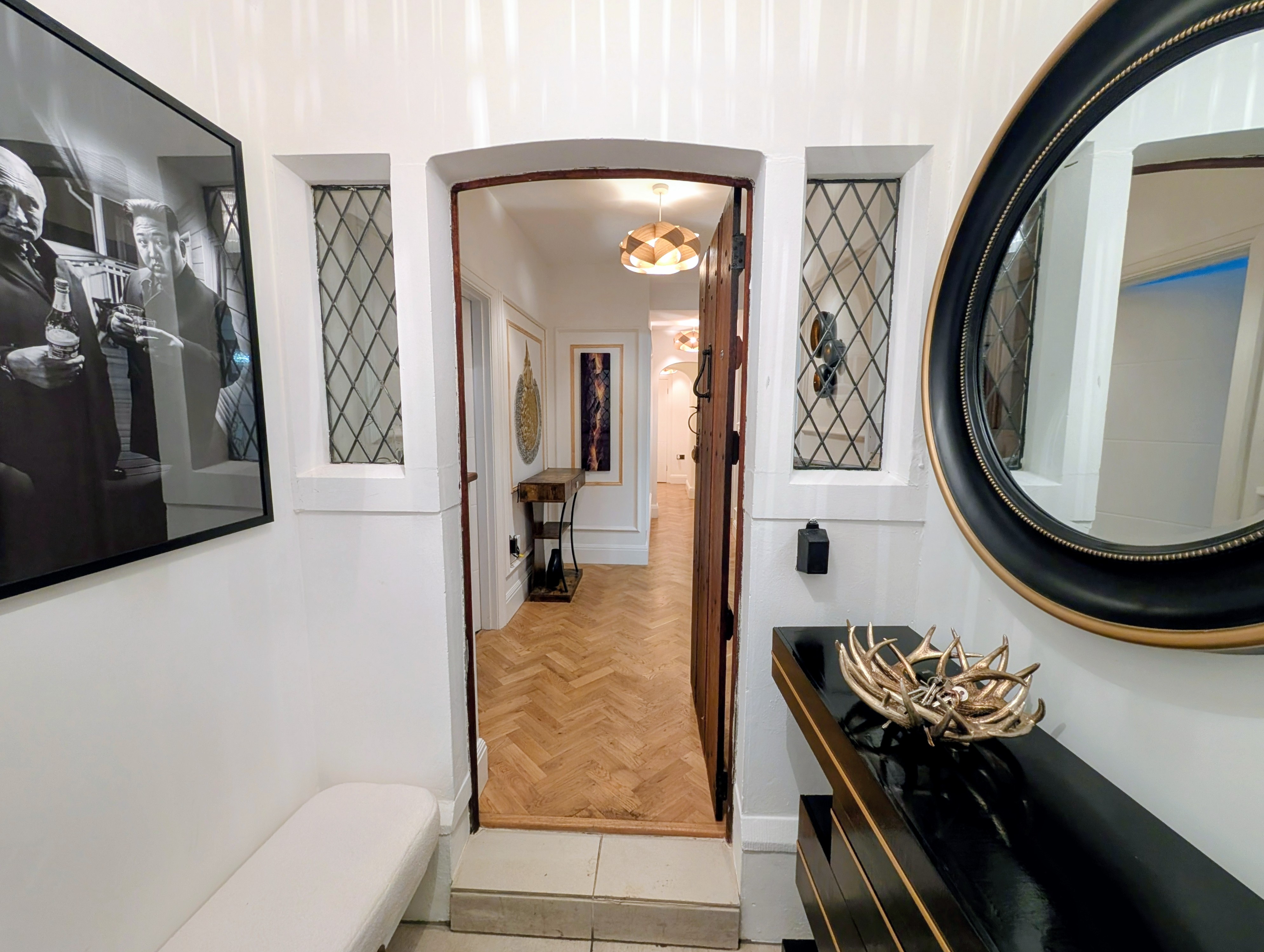 Arch doorway reveal into the grand hallway