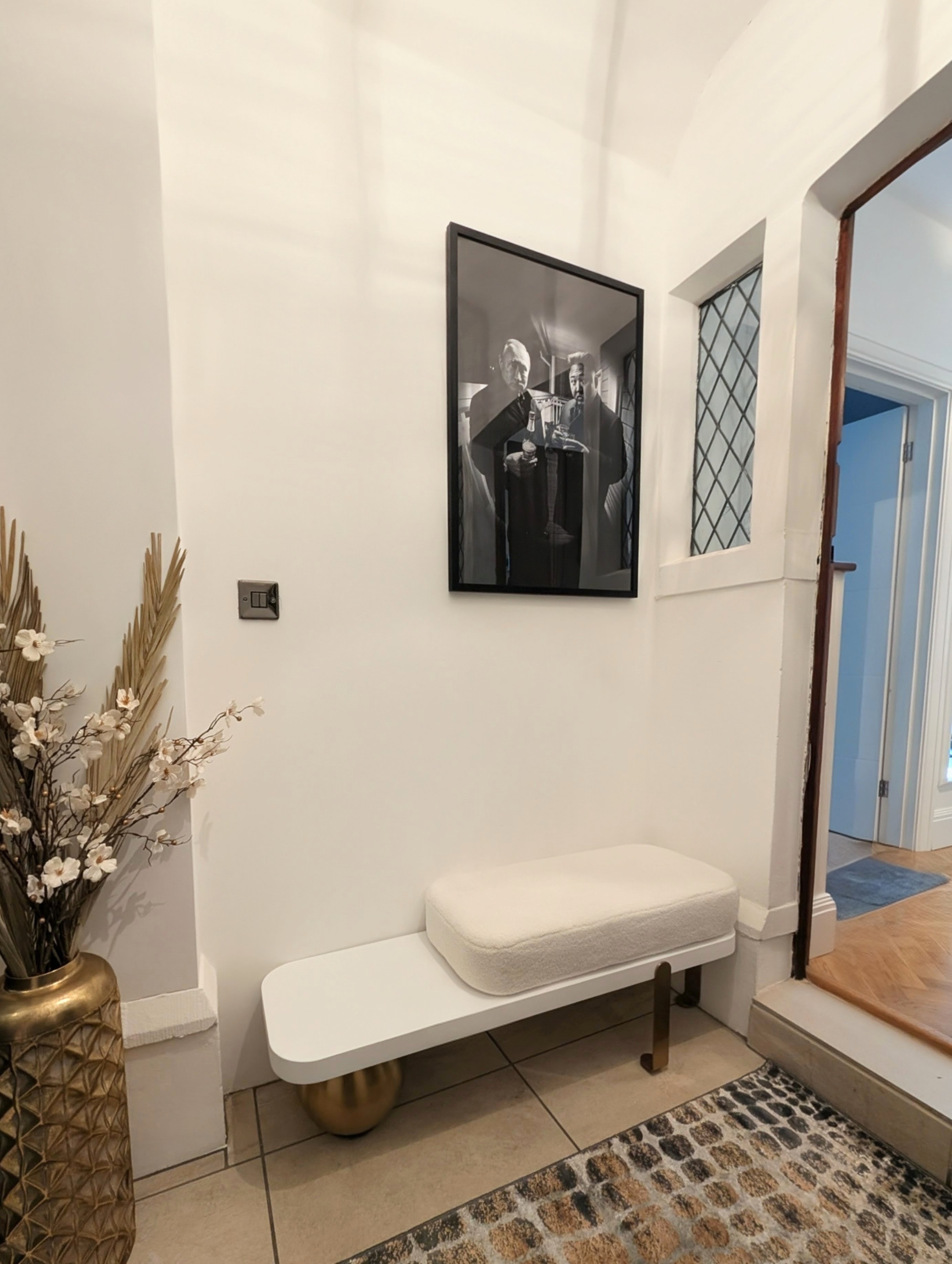 Bouclé bench with black and white art