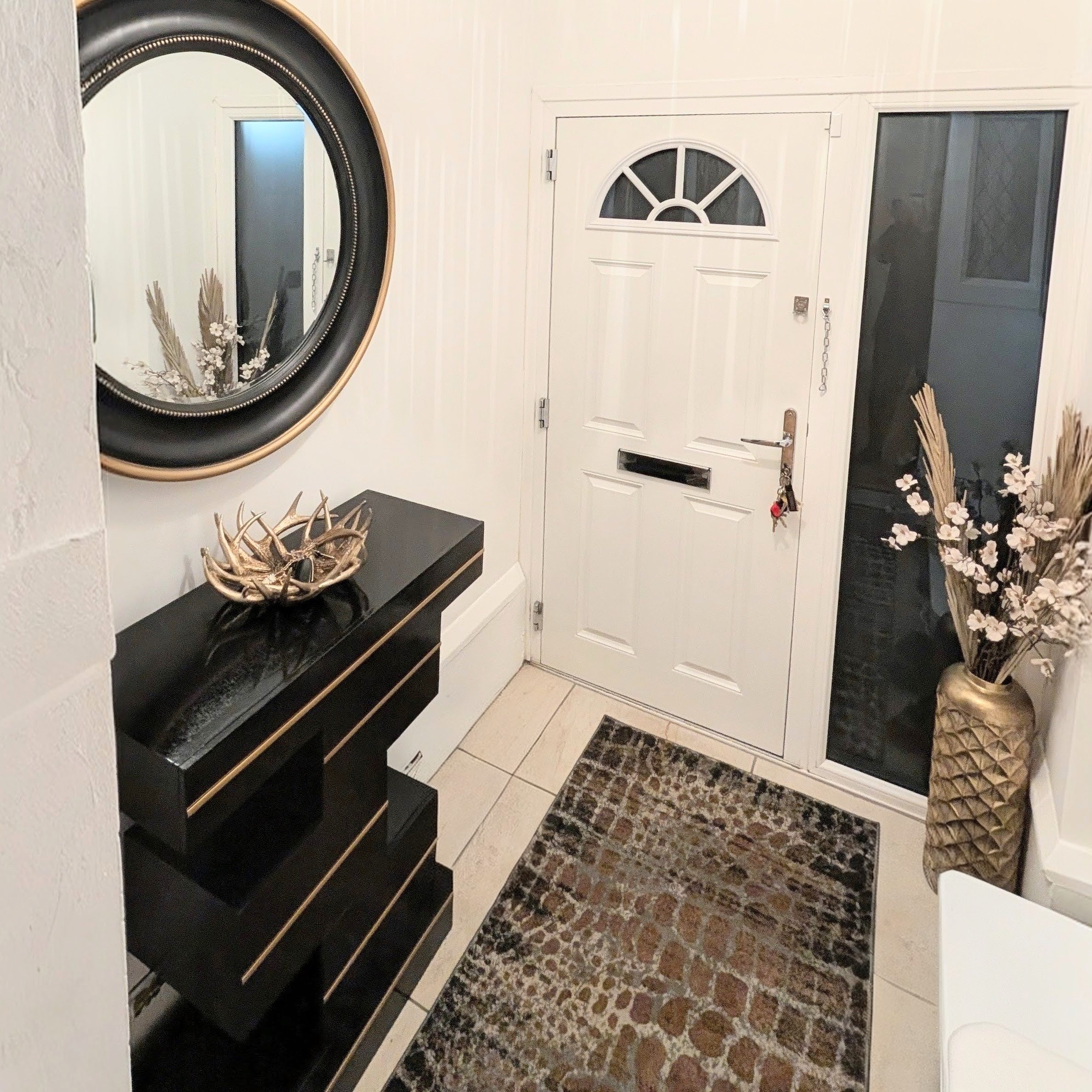 Entrance with front door and statement styling